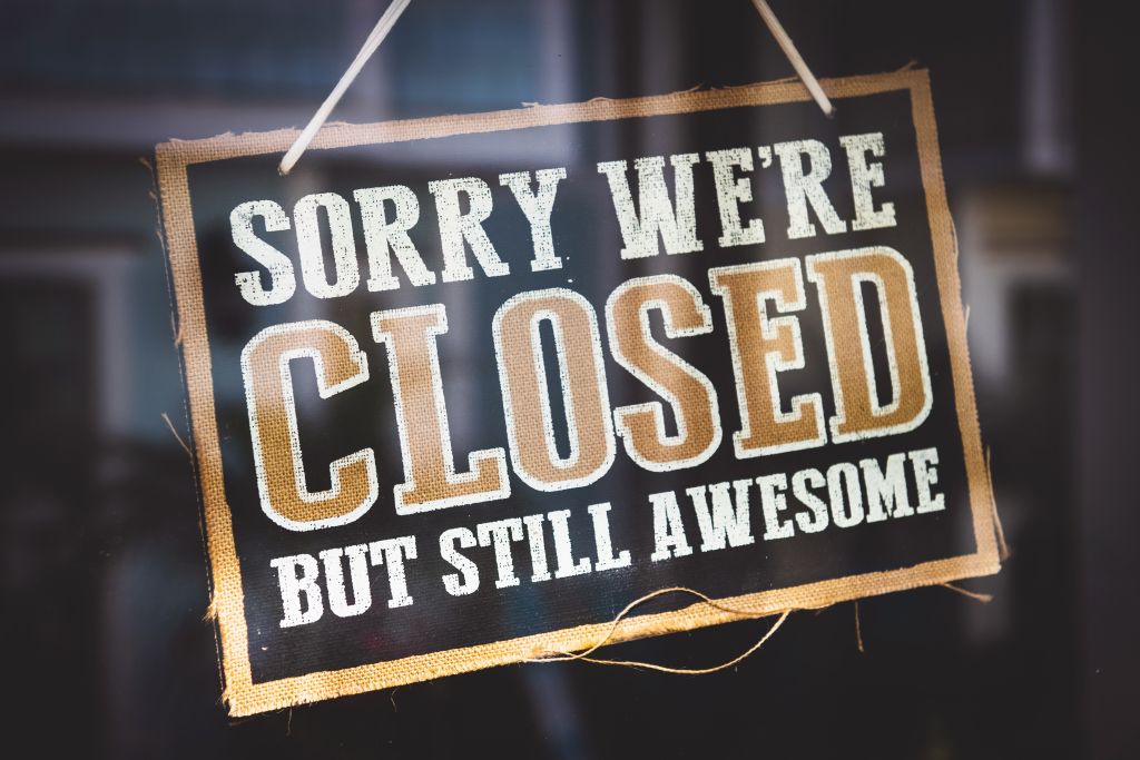 Door sign that says sorry we're closed but still awesome